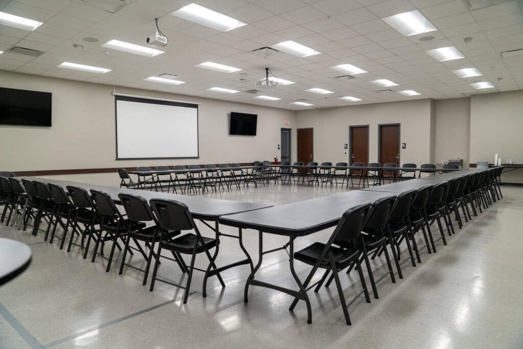 Versatile Gulf Coast conference room with seating for meetings, seminars, or events, featuring modern AV technology, spacious layout, and professional ambiance for Gulf Coast gatherings and events.